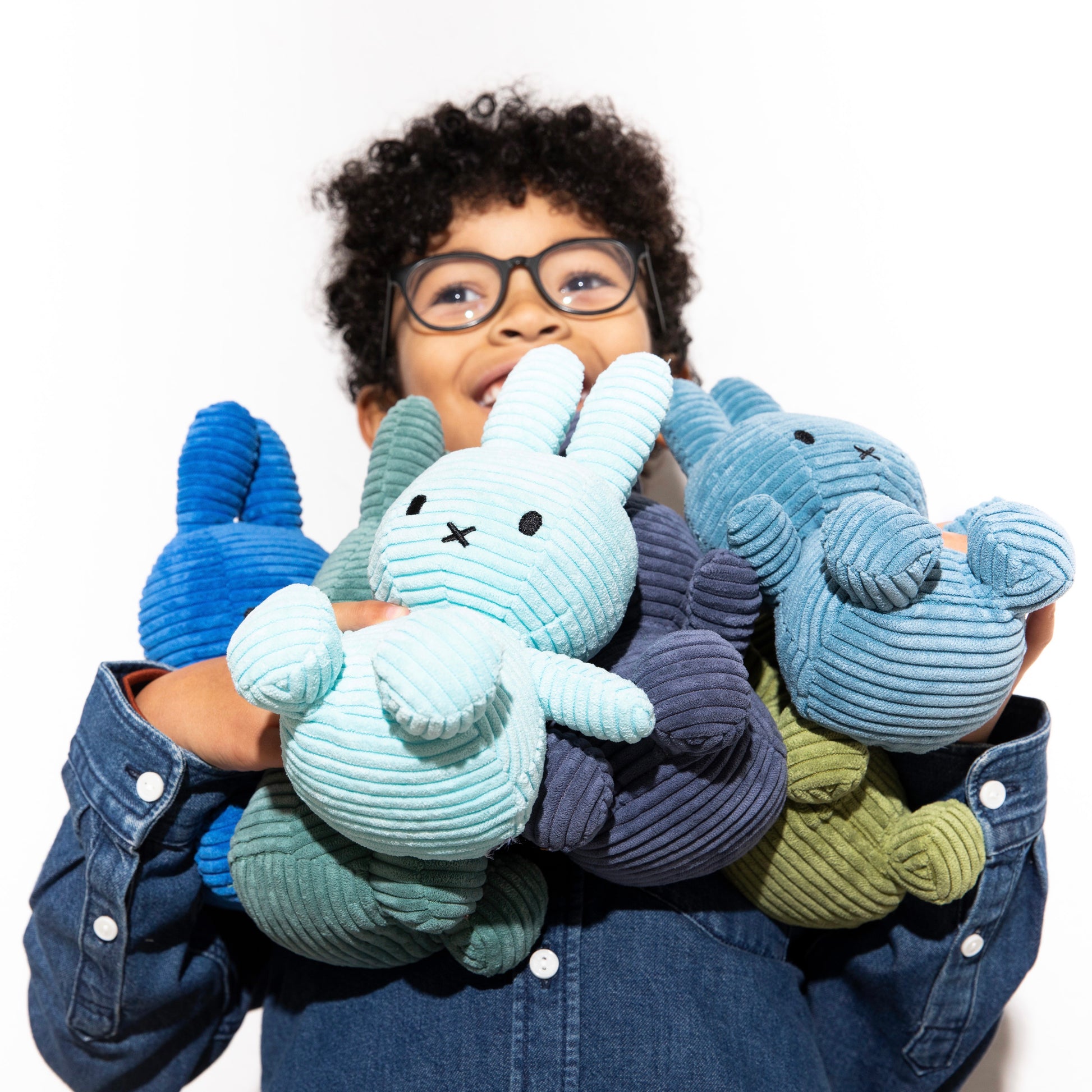 Boy with many miffy in arms